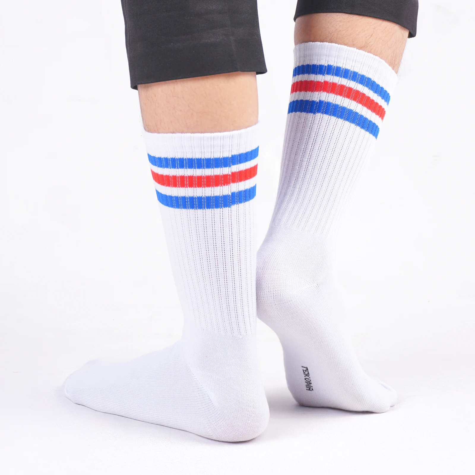 Tekoma Oldschool in white with red and blue stripes on foot
