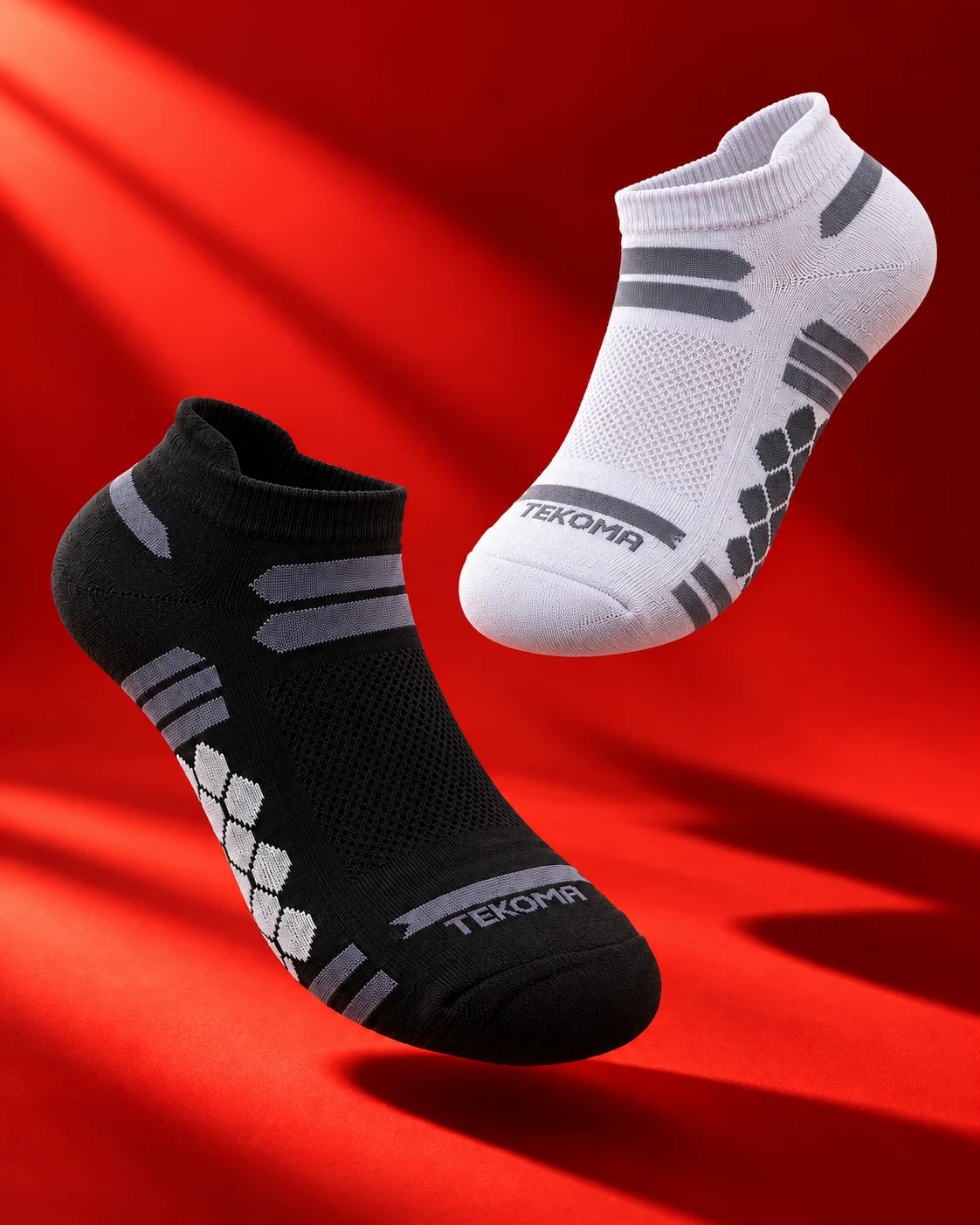Tekoma Ultralight black and white sock render against a red background